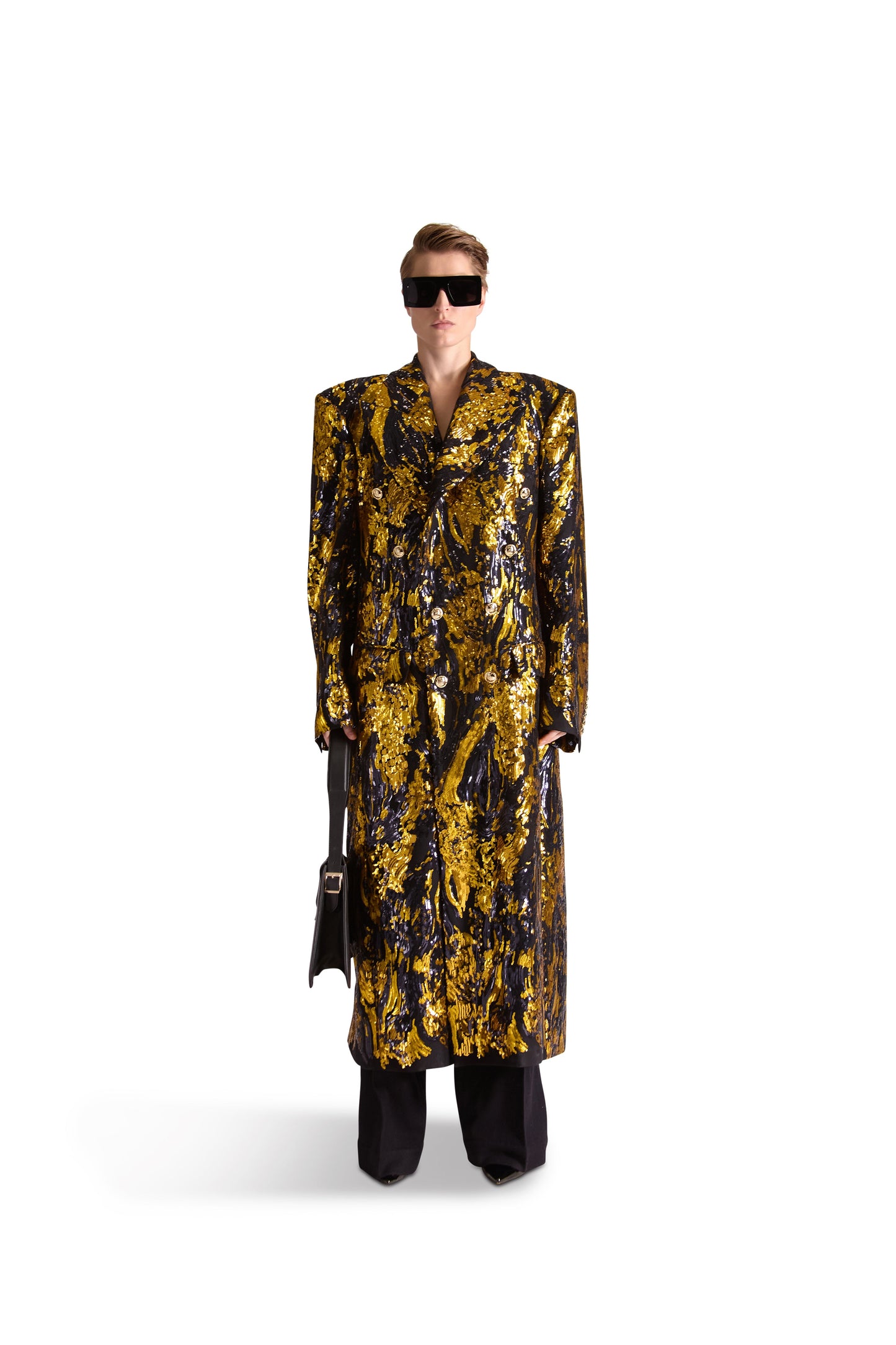 Hand embroidered peak lapel double breasted long coat in luxurious 100% British wool with exquisite silk lining and intricate sequin detailing, featuring eight exclusive monogram gold buttons. Perfect for stylish and sophisticated occasions.