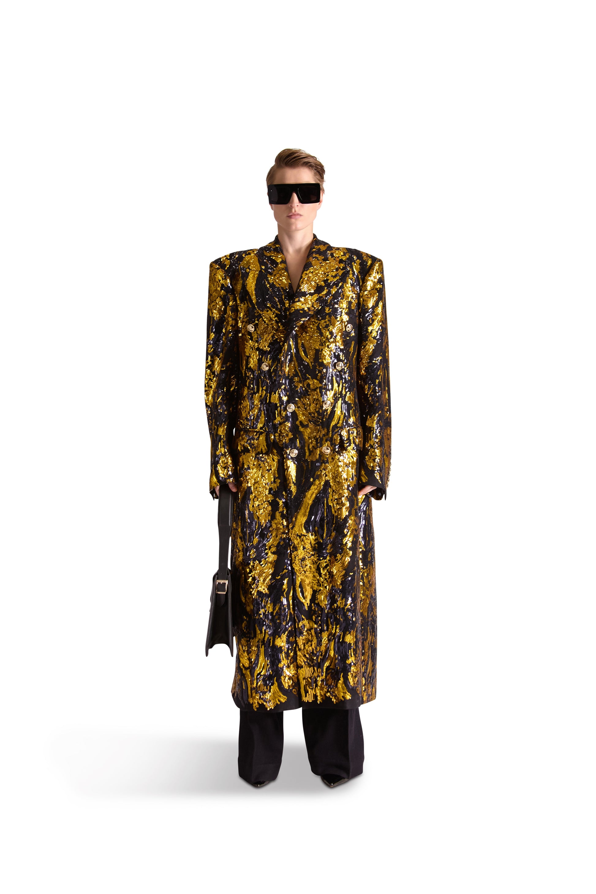 Hand embroidered peak lapel double breasted long coat in luxurious 100% British wool with exquisite silk lining and intricate sequin detailing, featuring eight exclusive monogram gold buttons. Perfect for stylish and sophisticated occasions.