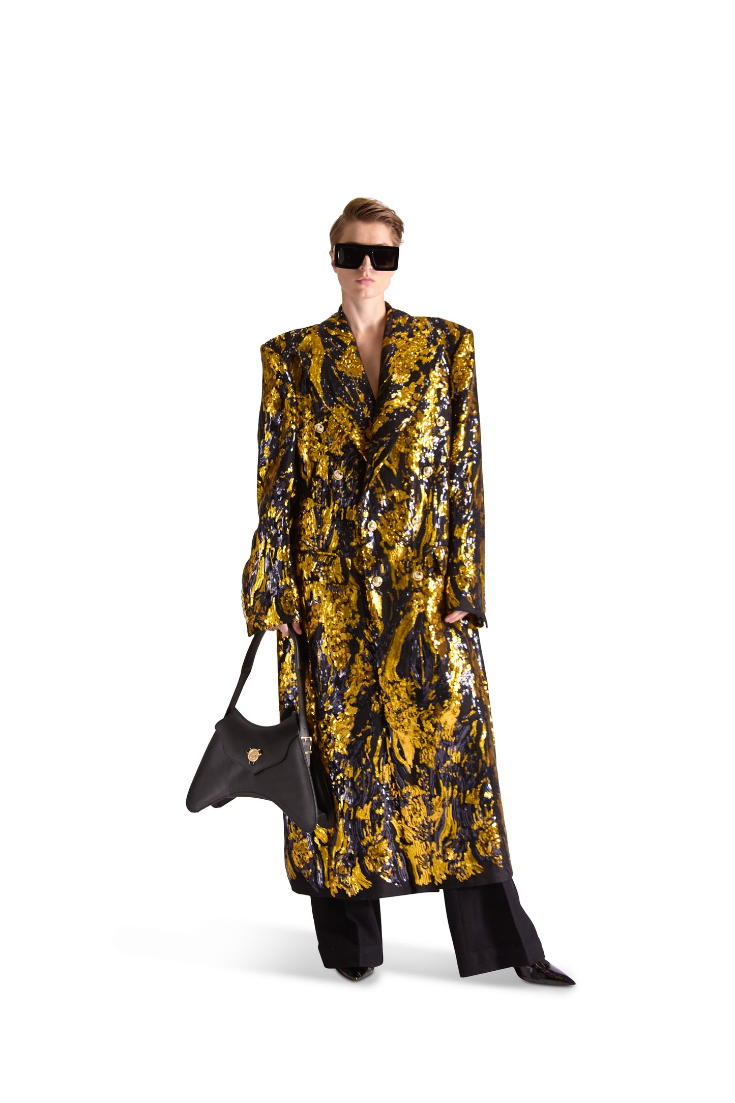 Close-up detail of the hand embroidered sequin design on the peak lapel double breasted long coat, highlighting the intricate artistry and luxurious materials synonymous with Helen Anthony.