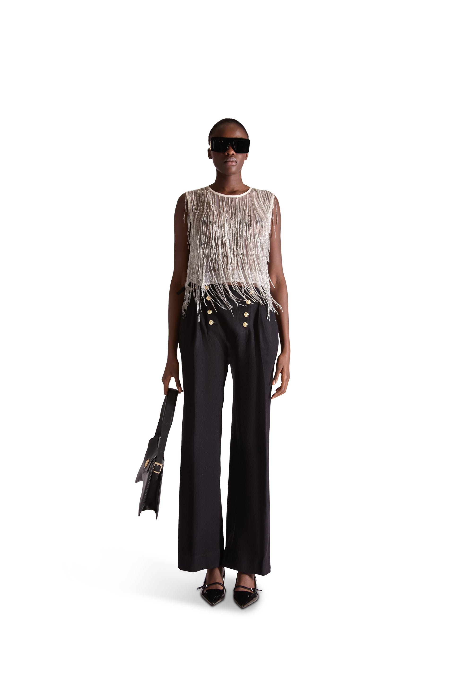 Luxury hand embroidered beaded tassel sleeveless crop top in sheer mesh fabric by Helen Anthony, featuring intricate bead embellishments, a round neckline, and a chic cropped design, made in Italy.