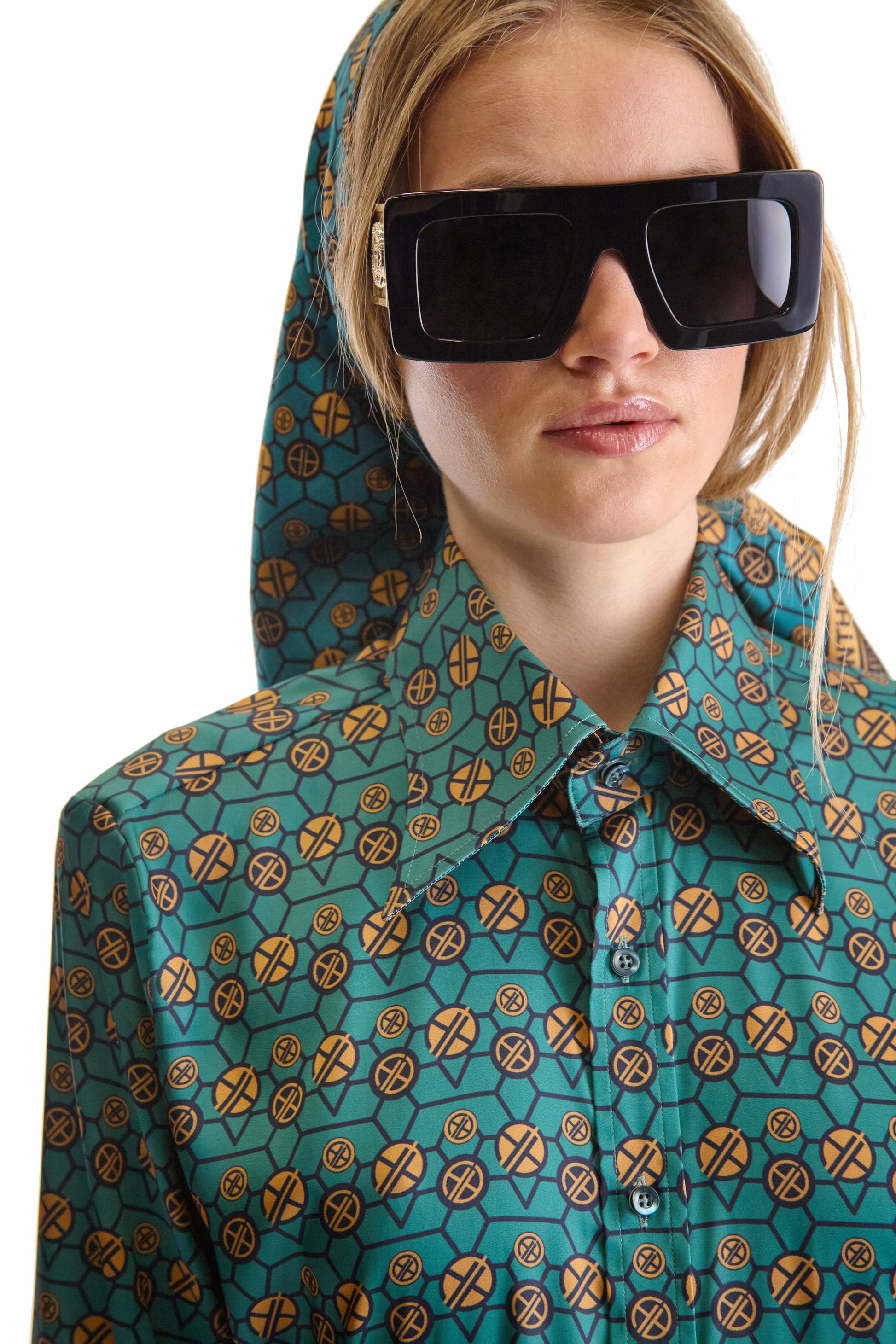 Close-up detail of the monogram print on a luxury tailored fit shirt, highlighting the exquisite fabric texture and craftsmanship, made in Italy.