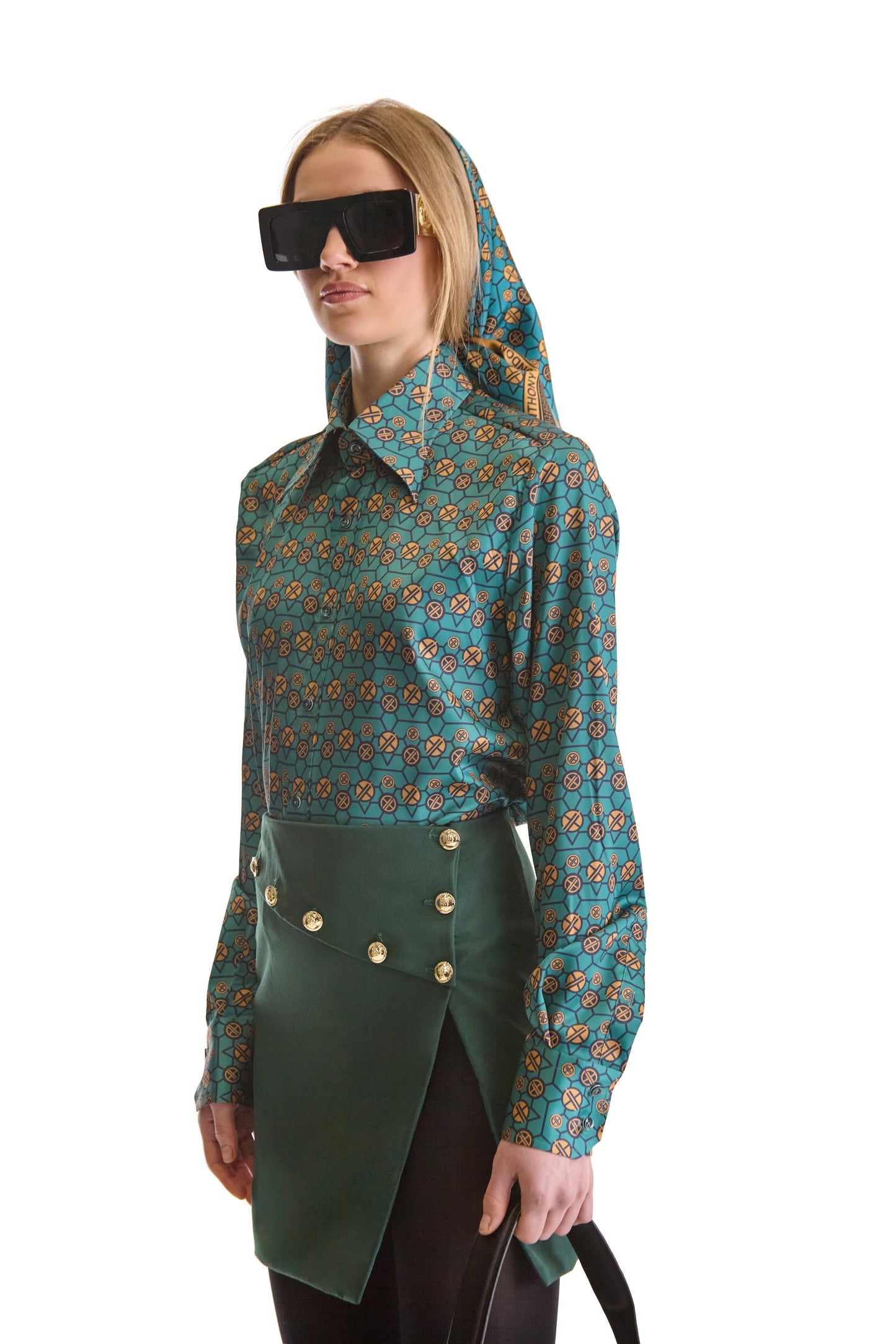 Two-button mitered cuffs with concealed pleated placket on Helen Anthony's luxury shirt, representing sophistication in design.