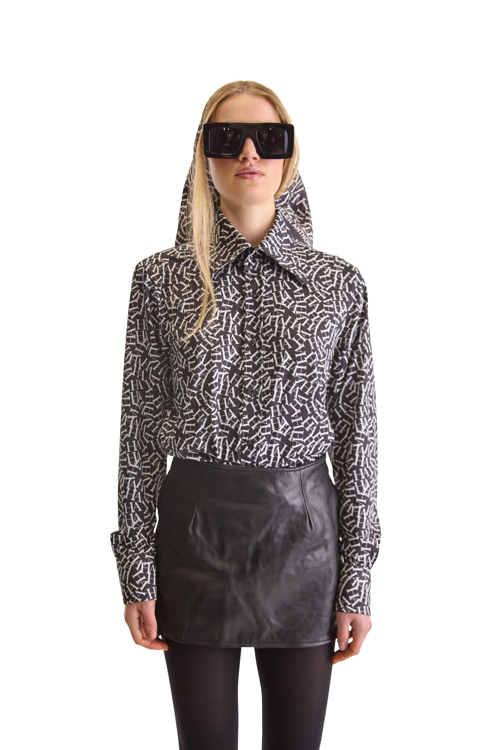 Elegant long-sleeved tailored shirt with two-button mitered cuffs and a concealed one-button pleated placket, embodying sophistication from Helen Anthony.