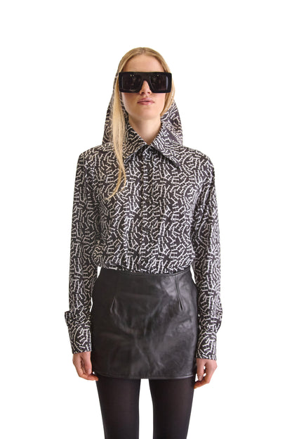 Elegant long-sleeved tailored shirt with two-button mitered cuffs and a concealed one-button pleated placket, embodying sophistication from Helen Anthony.