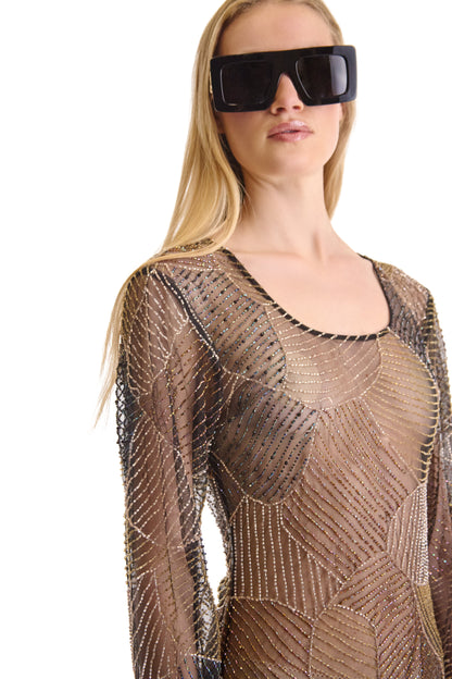 Back view of a stunning hand embroidered sheer evening dress, highlighting the elegant design details and the sophisticated zip closure.