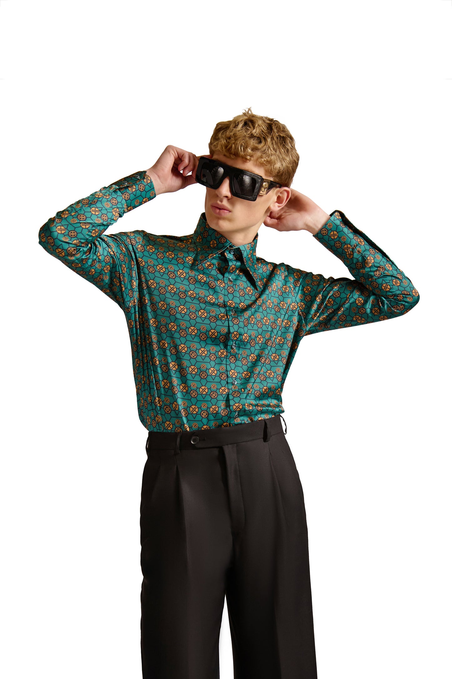 Elegant close-up of the mitered cuffs and pleated placket of a tailored monogram print shirt, crafted with premium woven fabric by Helen Anthony.