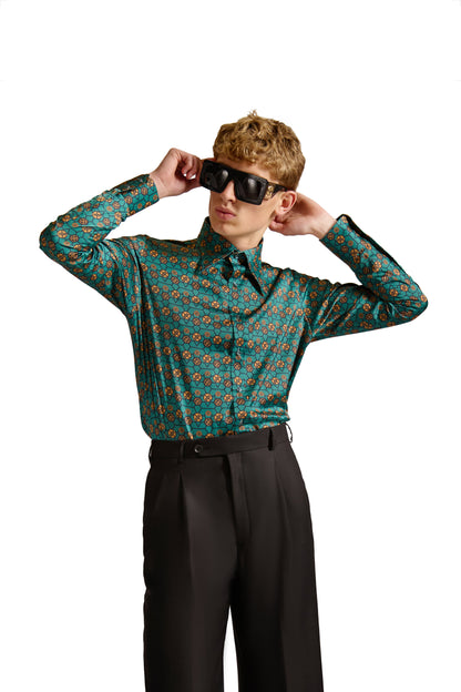 Elegant close-up of the mitered cuffs and pleated placket of a tailored monogram print shirt, crafted with premium woven fabric by Helen Anthony.