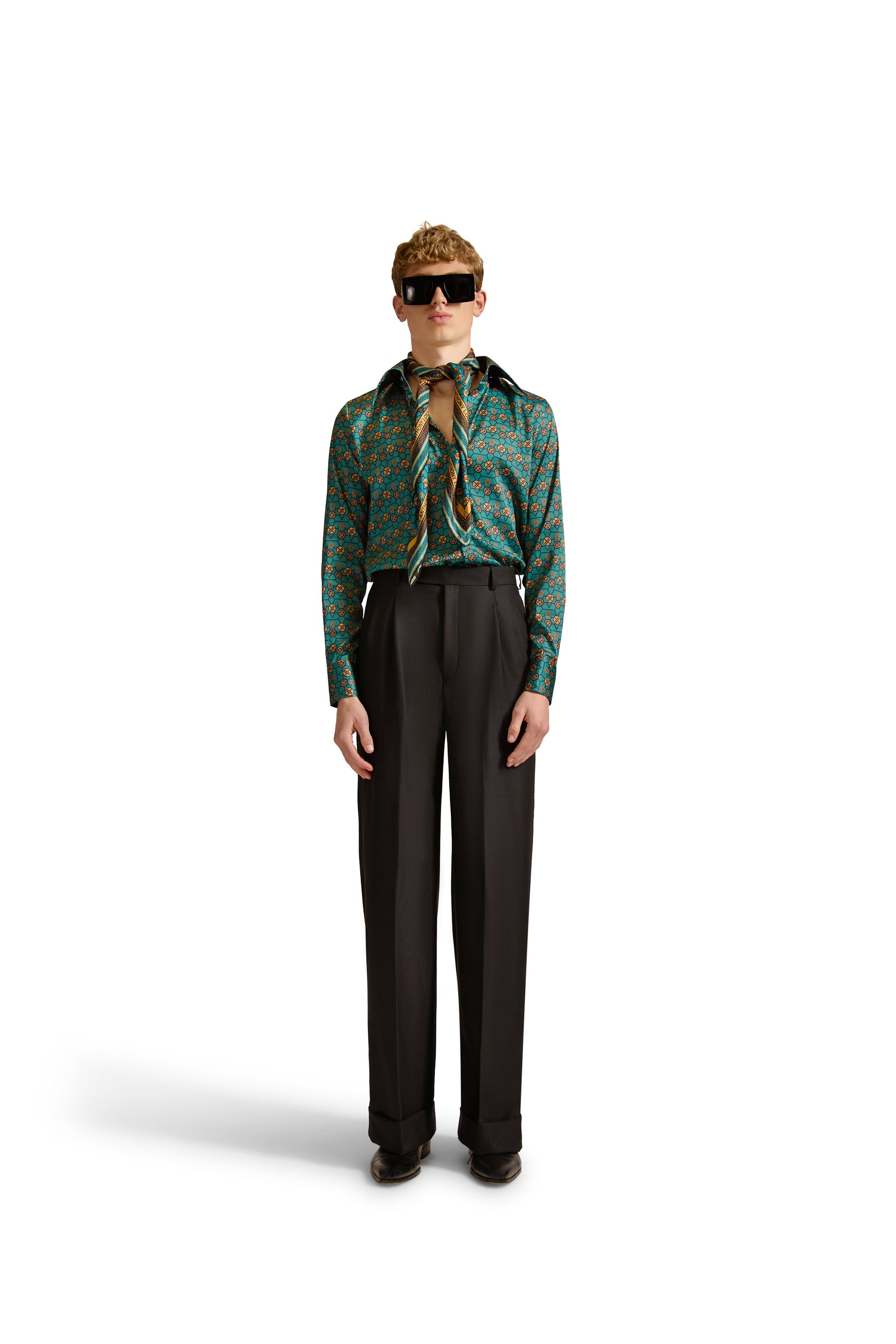 Sleek design elements of a Helen Anthony tailored shirt with geometric patterns, featuring a front button closure and refined pointed collar.