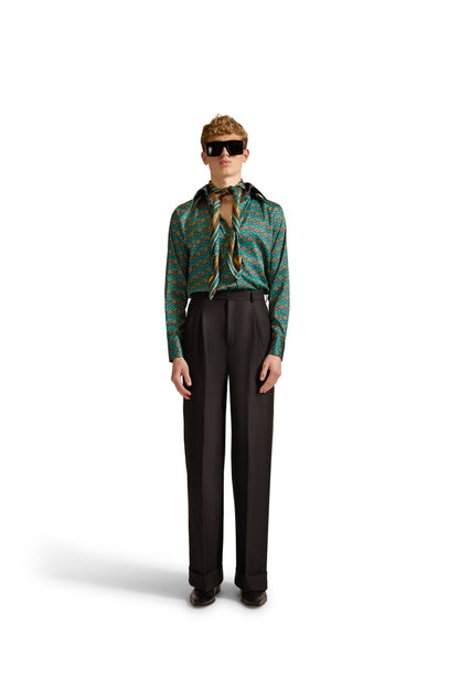 Sleek design elements of a Helen Anthony tailored shirt with geometric patterns, featuring a front button closure and refined pointed collar.