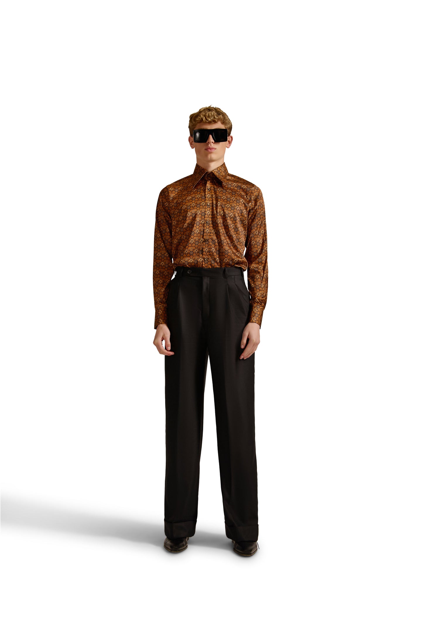 Stylish long-sleeved monogram shirt with a curved hem, made from fine woven fabric, epitomising luxury and sophistication by Helen Anthony.