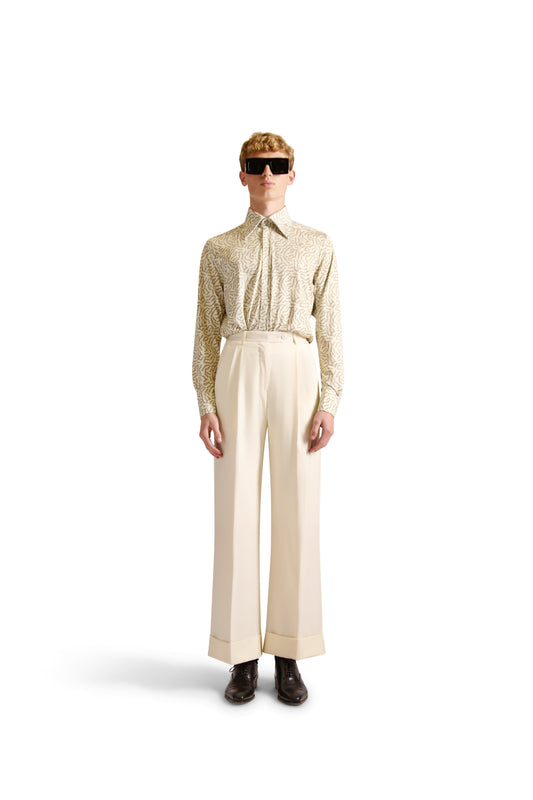 Luxury tailored fit shirt showcasing exclusive initial monogram design, crafted from premium knitted fabric, featuring long sleeves and a pointed collar.