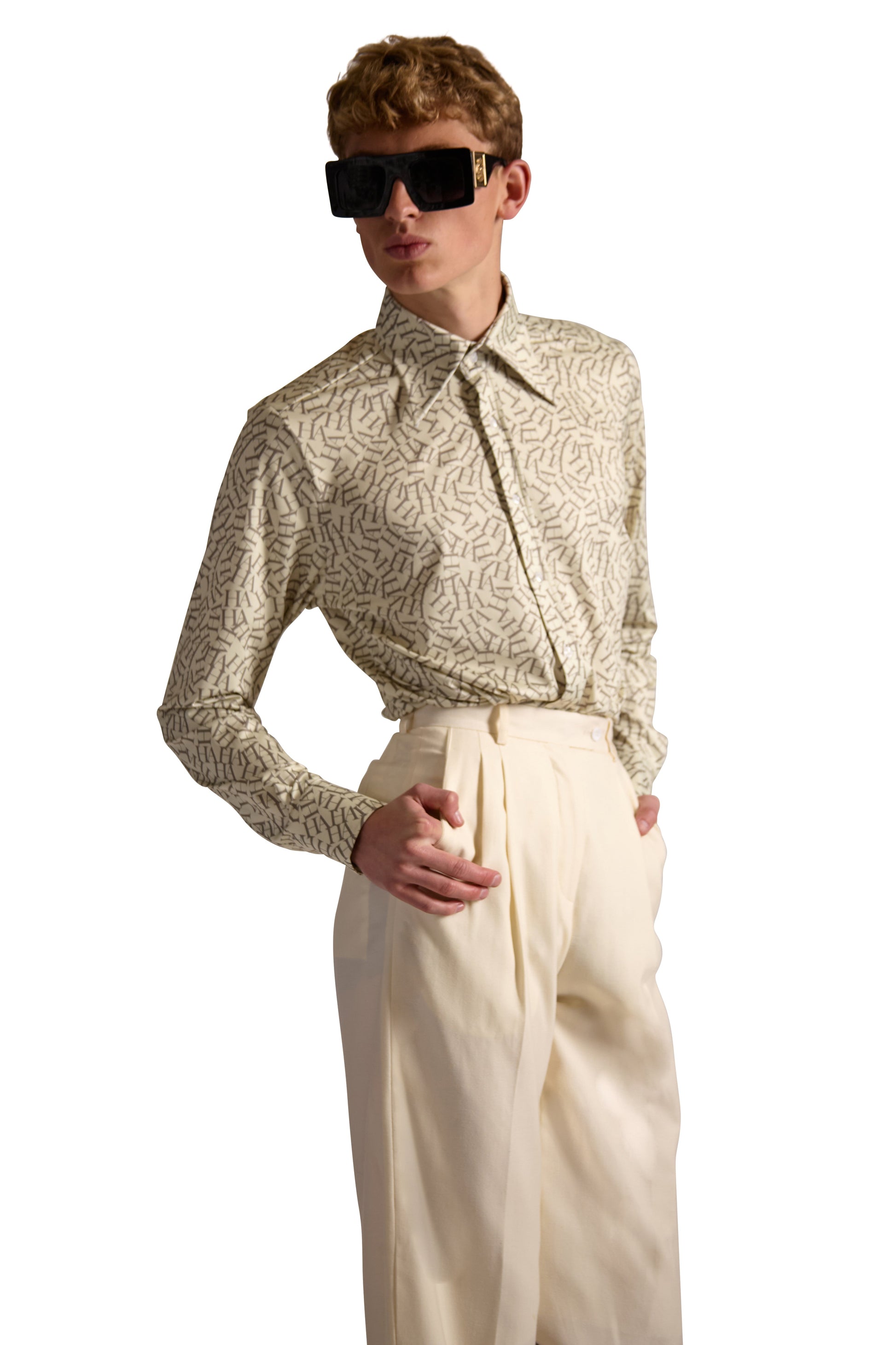 Two-button mitered cuffs of a premium tailored fit shirt, showcasing concealed pleated placket and exclusive monogram detail.