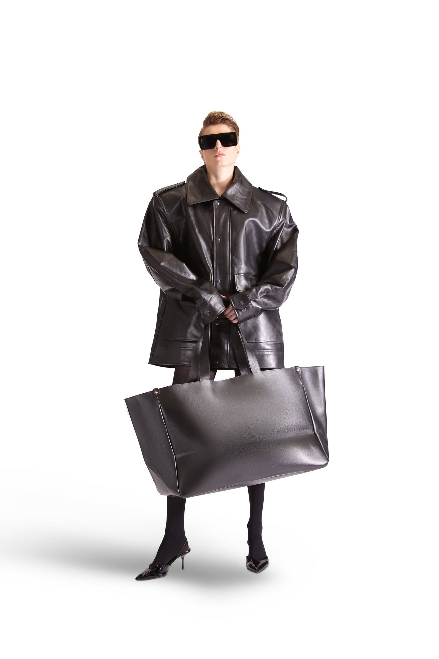 Luxury oversized leather shoulder Tote Bag by Helen Anthony, showcasing its elegant design and spacious interior with zips and pockets.