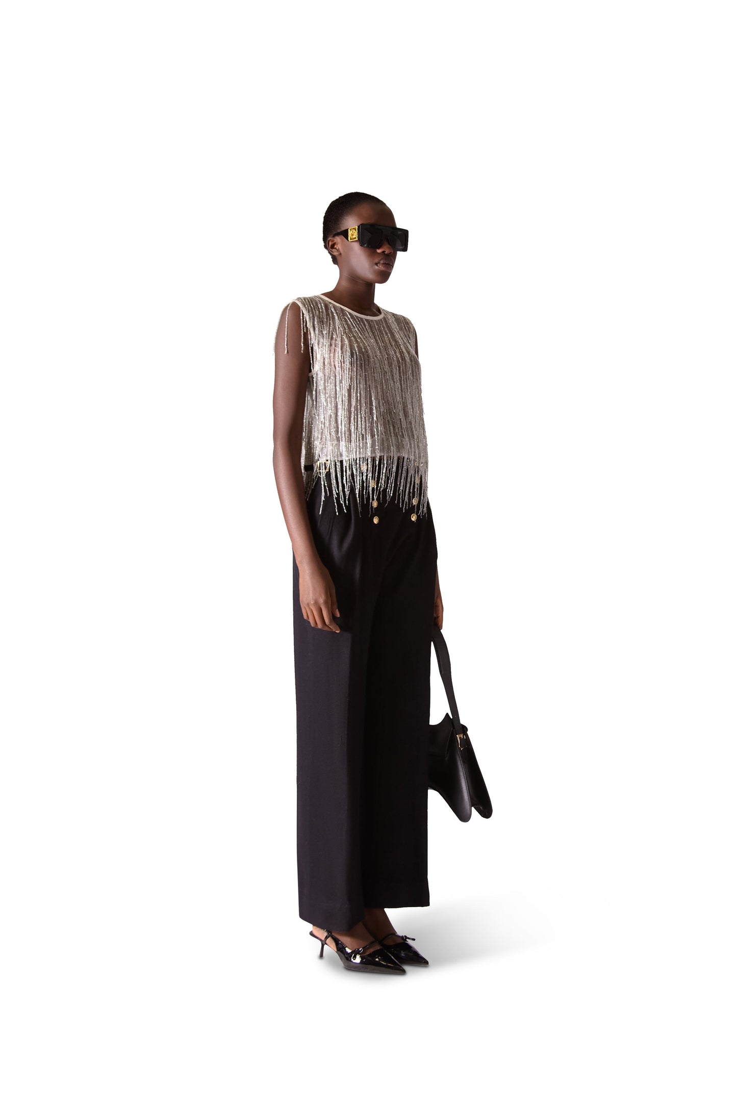 Elegant hand embroidered beaded tassel sleeveless crop top crafted from sheer mesh fabric by Helen Anthony, showcasing intricate embellishments and a chic round neckline.