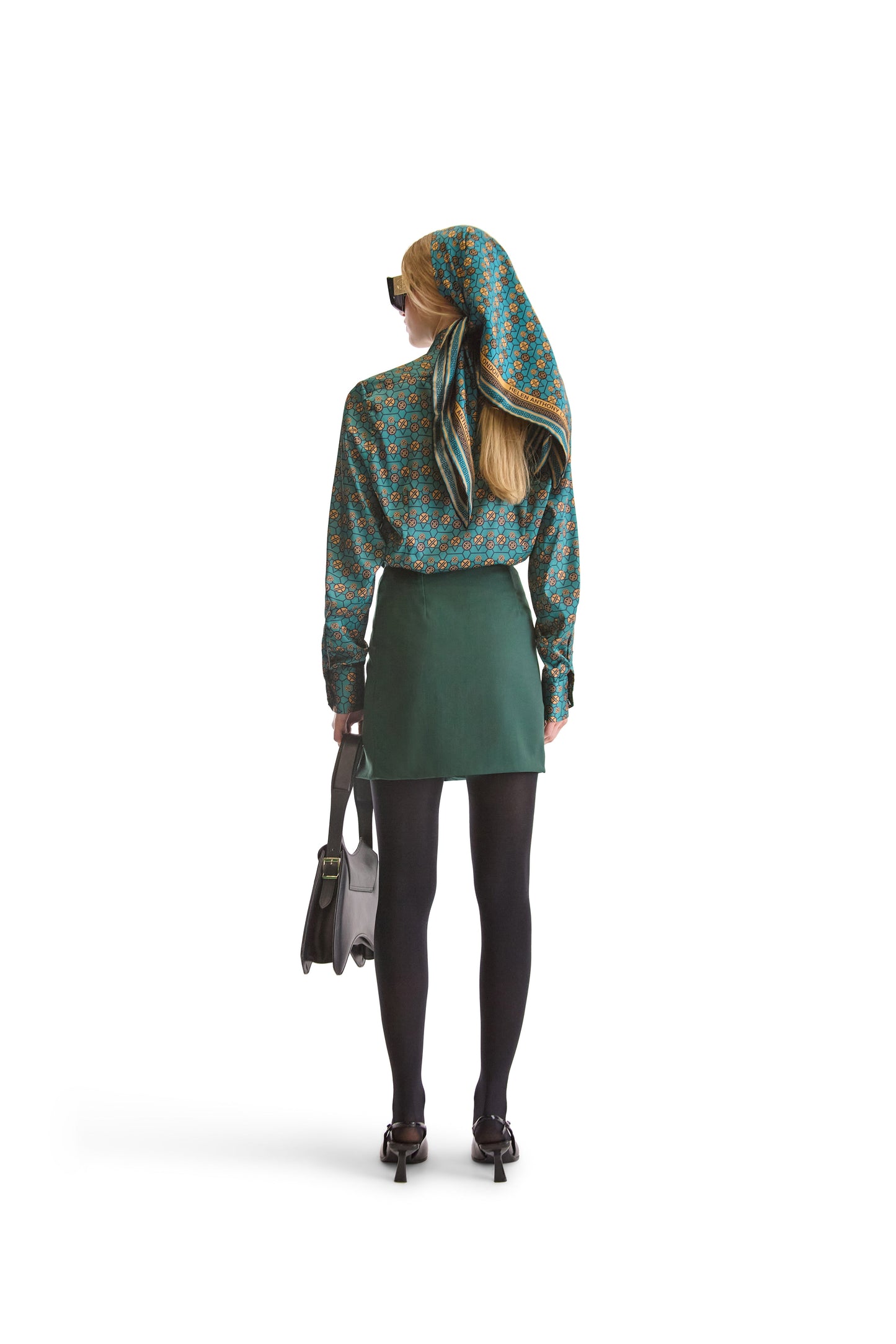 Elegant long sleeved shirt with a curved hem and stylish pointed collar, crafted from luxurious polyester and lycra blend.