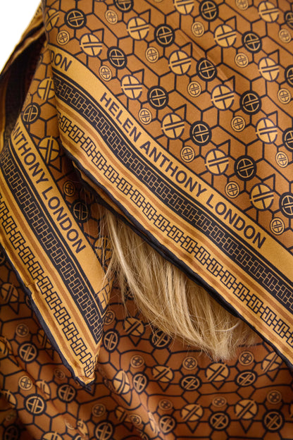 Exclusive Monogram Twill Silk Scarf by Helen Anthony, showcasing a luxurious geometric design and hand-rolled edges, perfect for stylish layering.