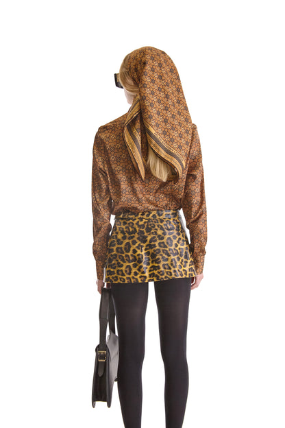 Wearing the Helen Anthony Monogram Twill Silk Scarf styled for fashion-forward elegance, perfect for any upscale occasion.