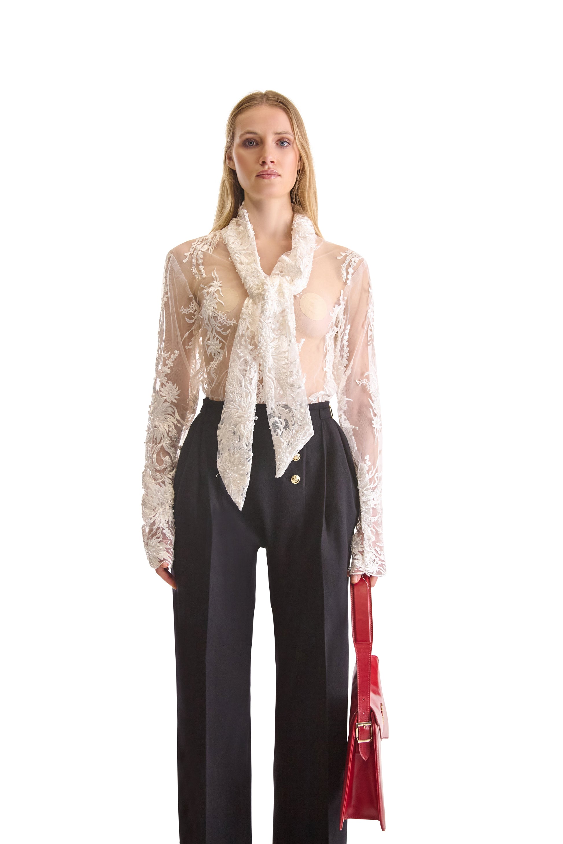 Detailed view of long sleeves and hand embroidered cuffs of the Helen Anthony sheer blouse, featuring exquisite bead trims and fine mesh fabric.