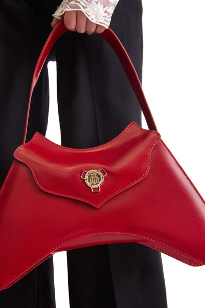 Close-up of the gold finish magnetic snap closure on the Helen Anthony calfskin leather handbag, highlighting exquisite craftsmanship.