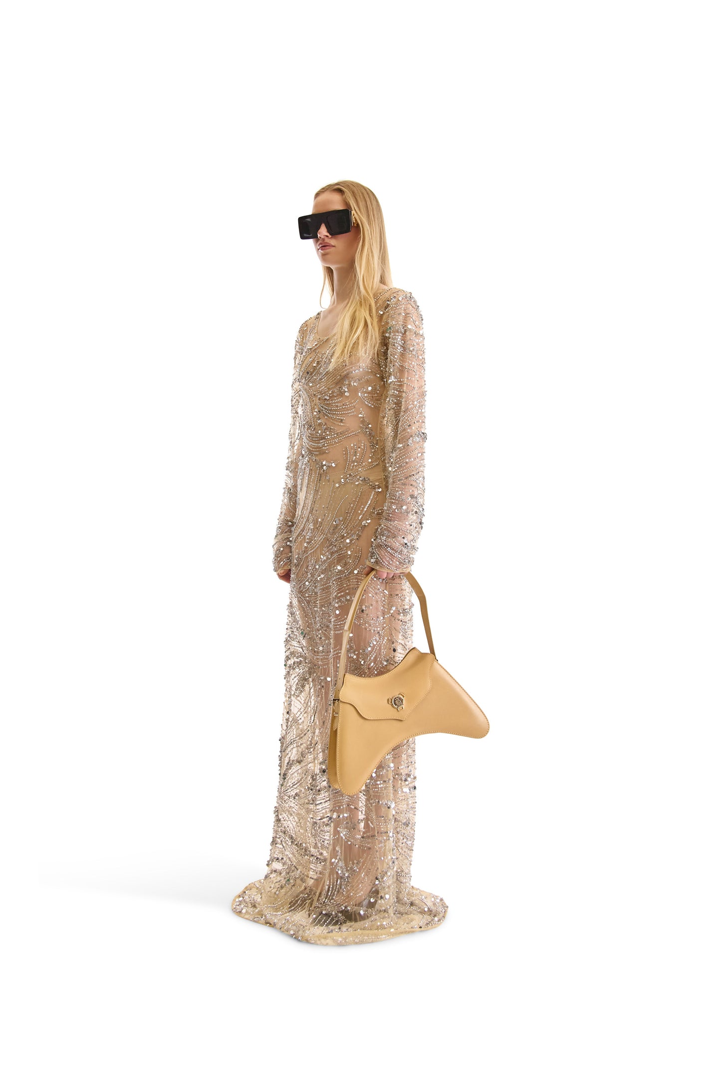 Detailed close-up of the shimmering silver bead and sequin embroidery on a luxurious evening dress by Helen Anthony, highlighting the craftsmanship and Italian design.