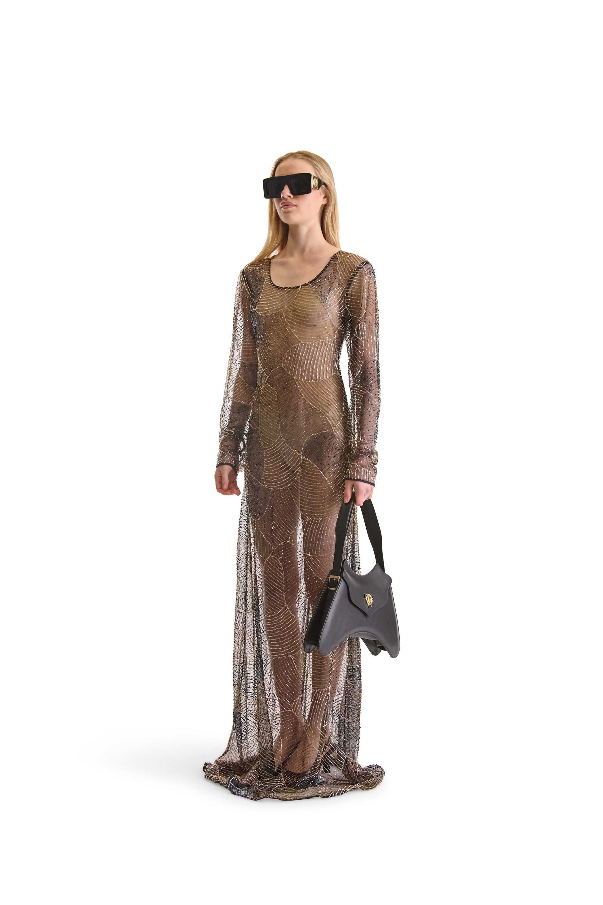 Luxurious hand embroidered sheer evening dress with long sleeves, exquisite bead detailing, and elegant back zip closure, designed by Helen Anthony in Italy.