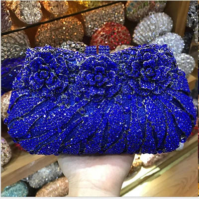 Sophisticated women's metallic clutch with luxurious rhinestone detailing, a perfect accessory for evening wear and special occasions.