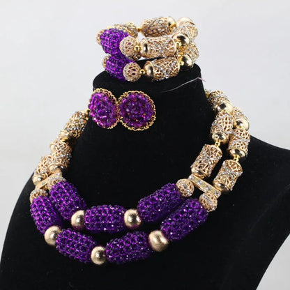 Luxurious purple 3-piece women's jewelry set featuring stylish stud earrings, an elegant 18-inch necklace, and a chic 8-inch bracelet in a trendy Nigerian design.