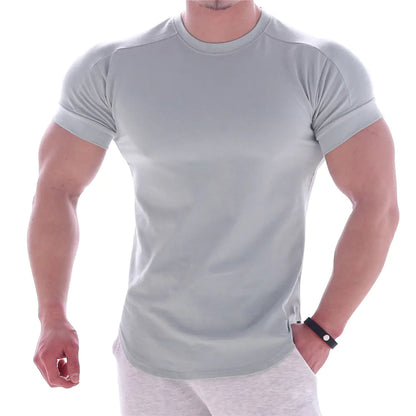 Chic men's premium compression T-shirt in light grey, crafted from quick-dry milk silk, offering elegance and functionality for fitness enthusiasts.