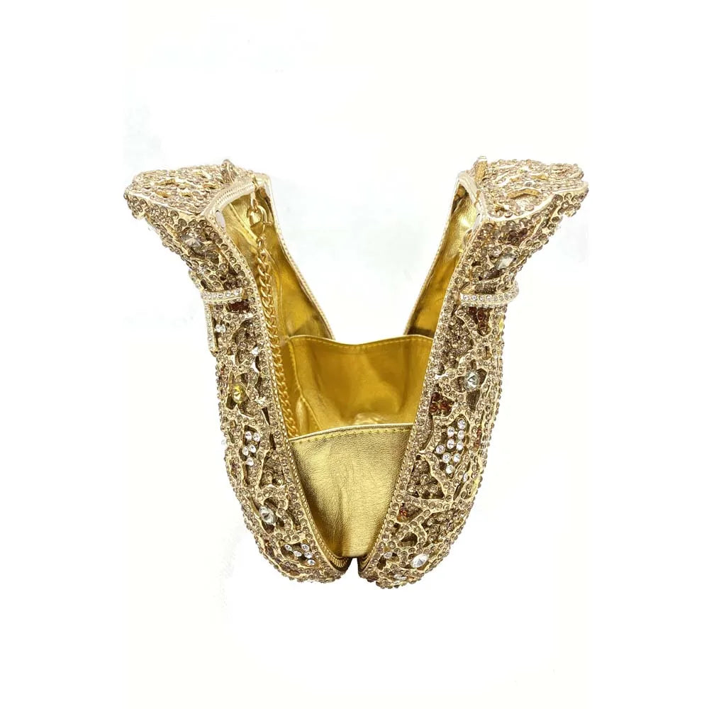 Stylish minaudière evening bag for women, featuring a sophisticated design and metallic finish suitable for upscale occasions.