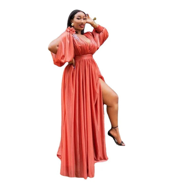 Full body view of a woman wearing a stylish African maxi dress in kanga design, perfect for traditional and casual occasions.