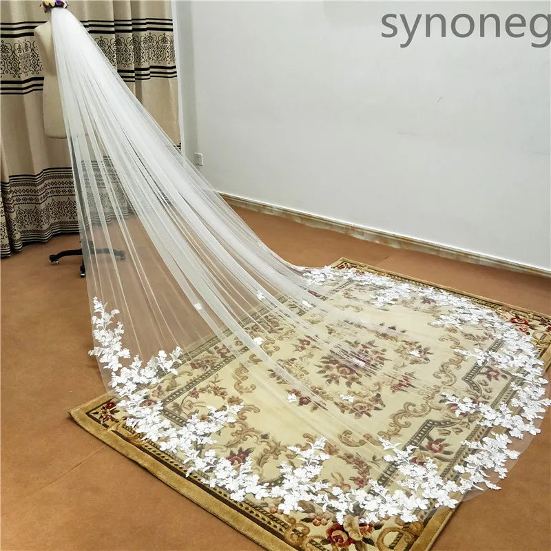 Dramatic shot of a cathedral veil cascading down in a graceful flow, highlighting its elegant and timeless appeal.