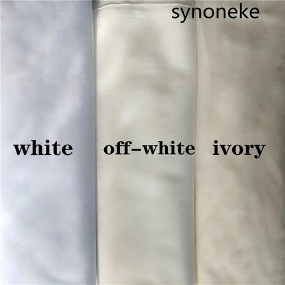 Close-up detail of luxurious lace edge and appliqué design on a cathedral wedding veil, showcasing intricate craftsmanship for the discerning bride.