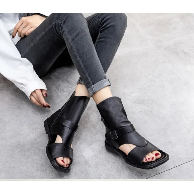 Elegant flat sandals crafted from genuine cow leather, showcasing a classic Roman style ideal for summer outings.