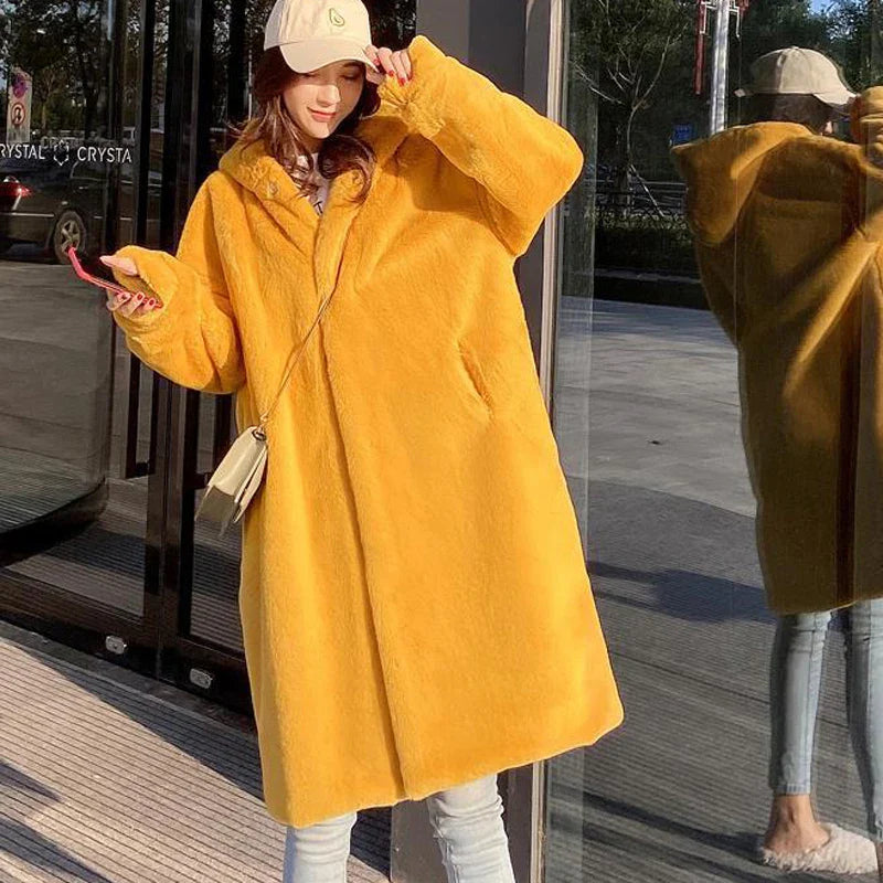 Elegant women's luxury faux fur hooded long overcoat featuring classic covered button closure and convenient pockets, perfect for a stylish winter look.