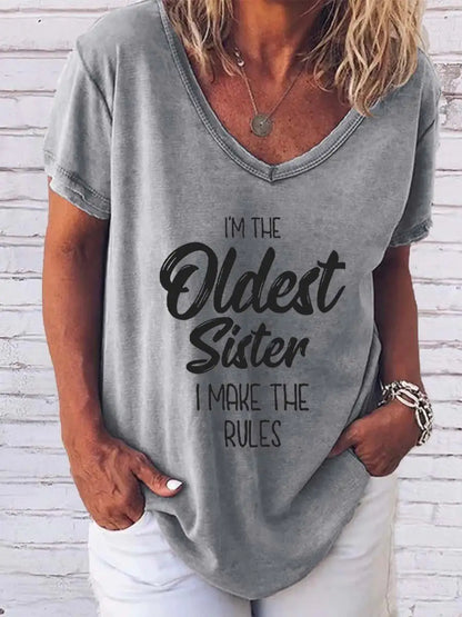 Fashion-forward display of the 'I'm The Oldest Sister' Print Tee from Dazzling Dreams Studio, perfect for asserting your sisterly authority with style.