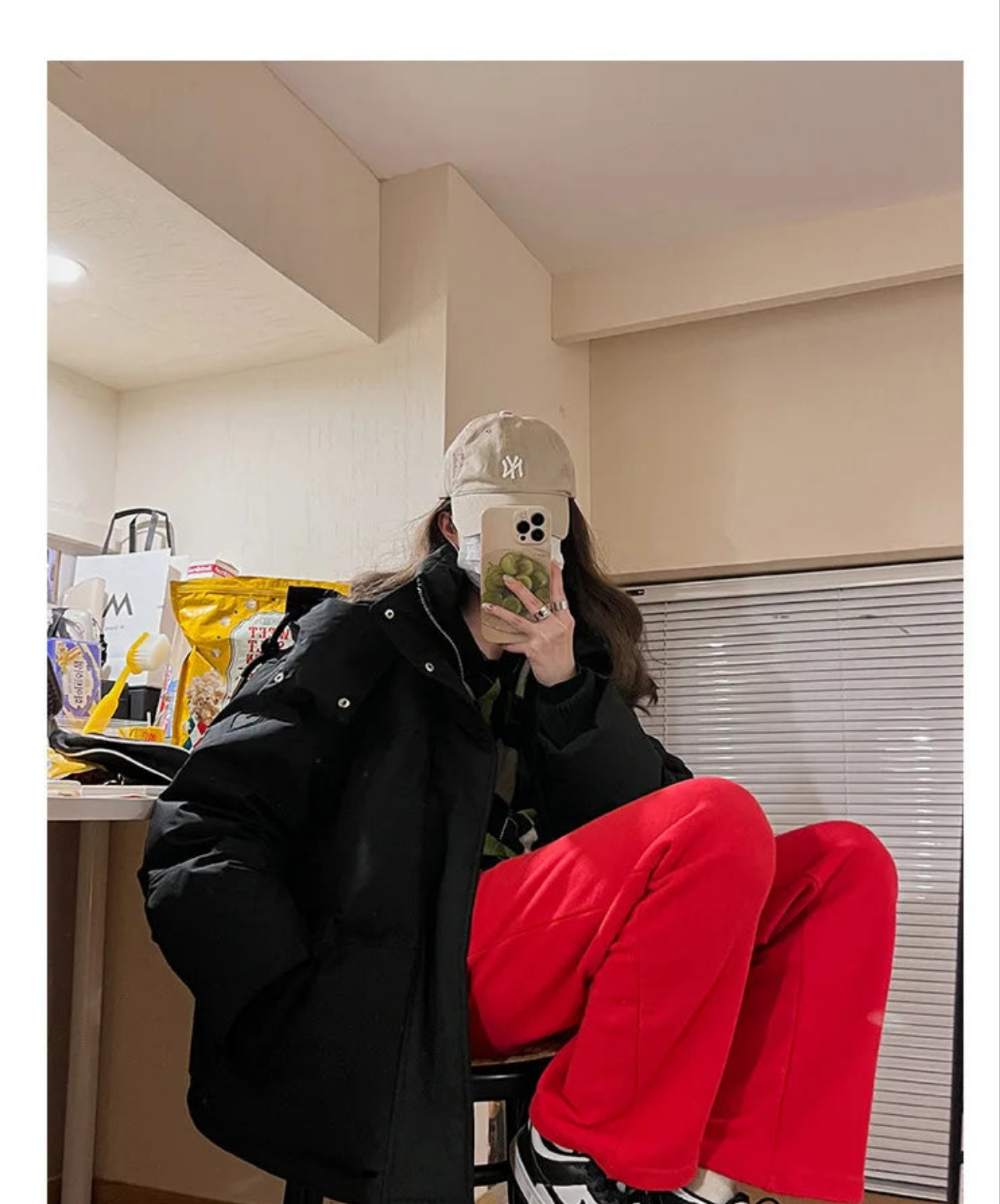 Model wearing a luxurious thick warm hooded down cotton jacket, epitomising sophistication and comfort during the winter season.