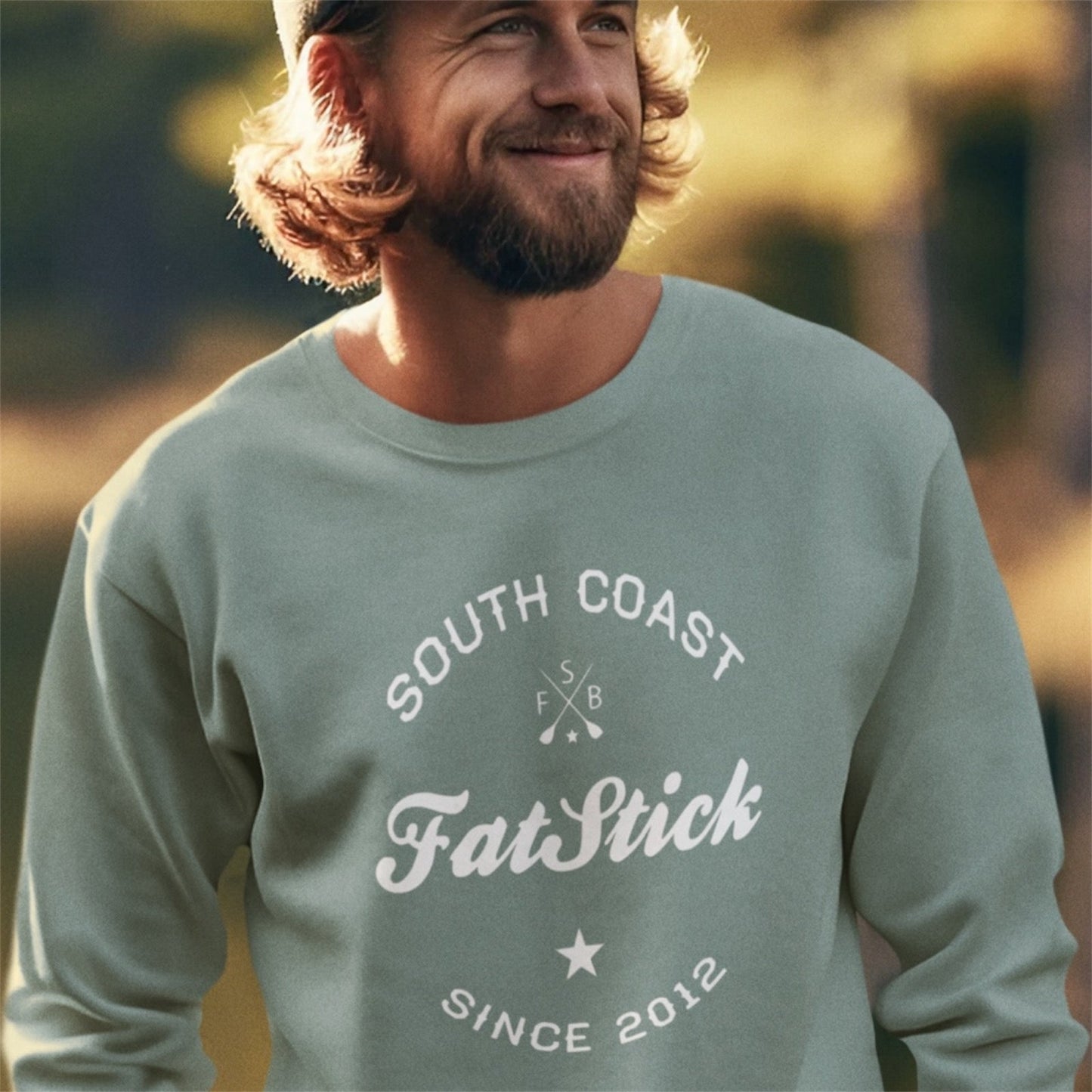 Luxurious FatStick South Coast Eco-Friendly Unisex Lifestyle Sweater showcasing a large flock printed logo, perfect for stylish layering.