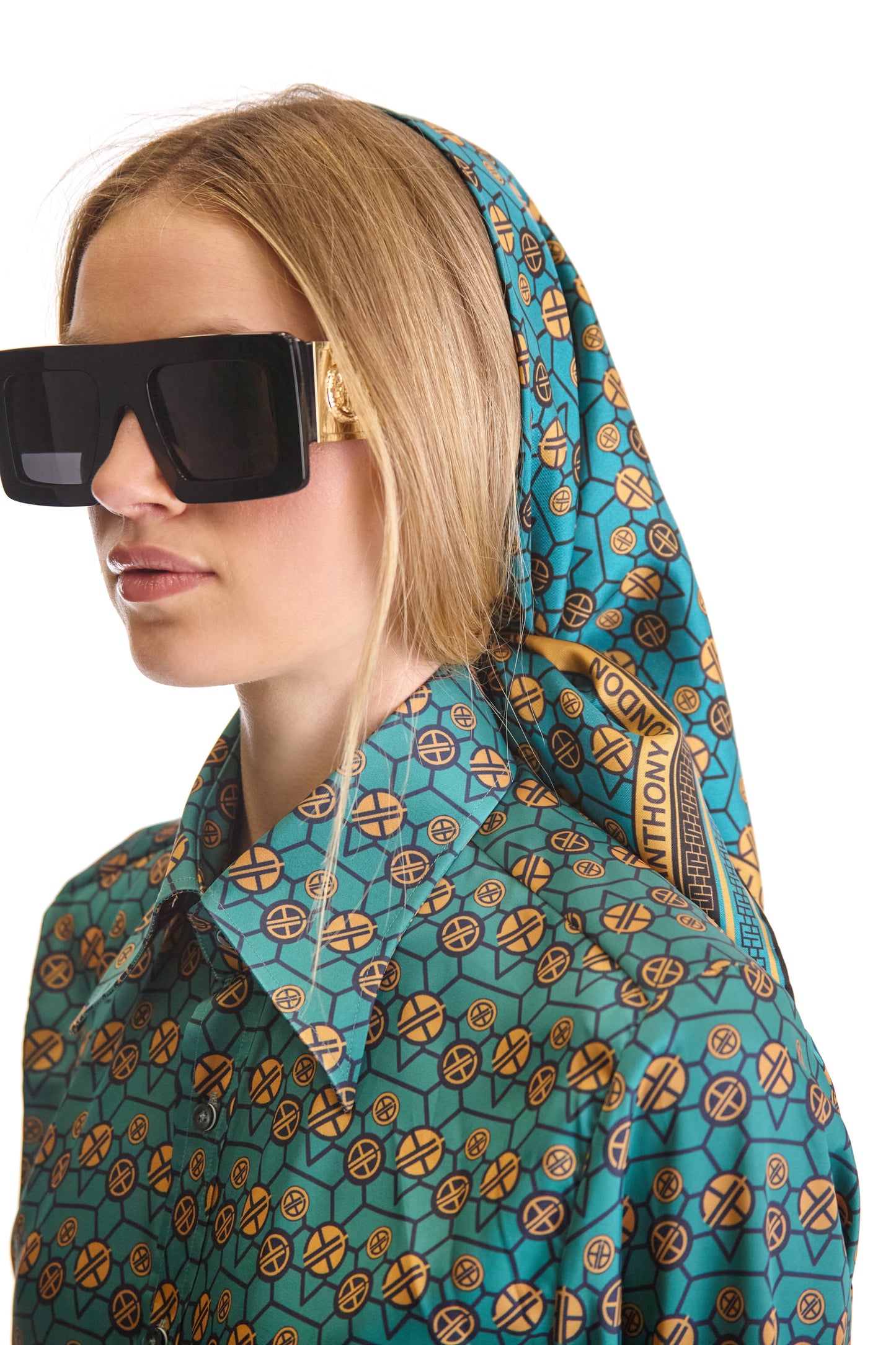 Luxury tailored fit monogram print woven shirt featuring a sleek pointed collar and a stylish curved hem, crafted from premium fabric, showcasing exquisite Italian design by Helen Anthony.