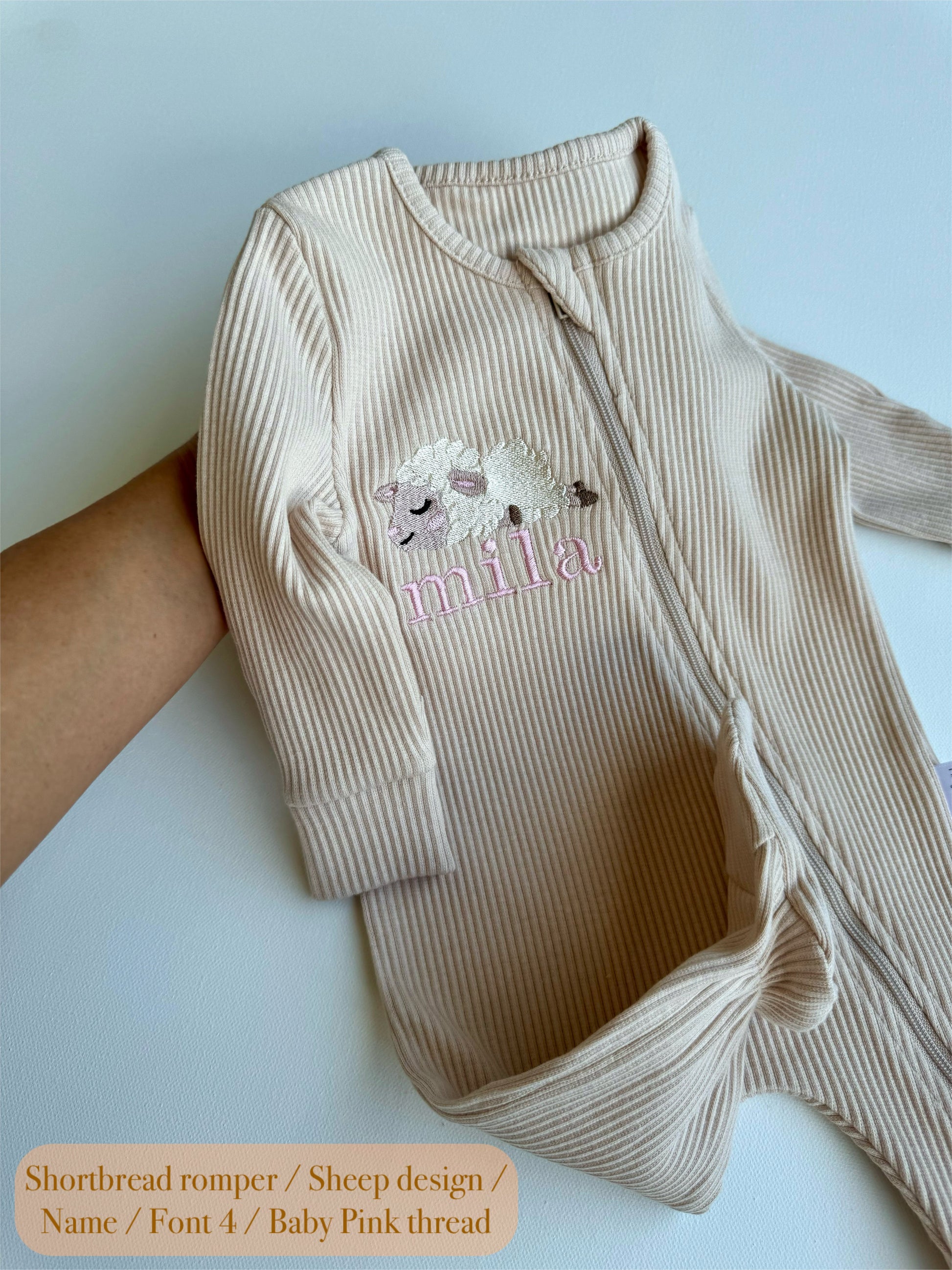 Elegant personalised safari-themed baby zip romper by DreamBuy with adorable embroidered lion design.