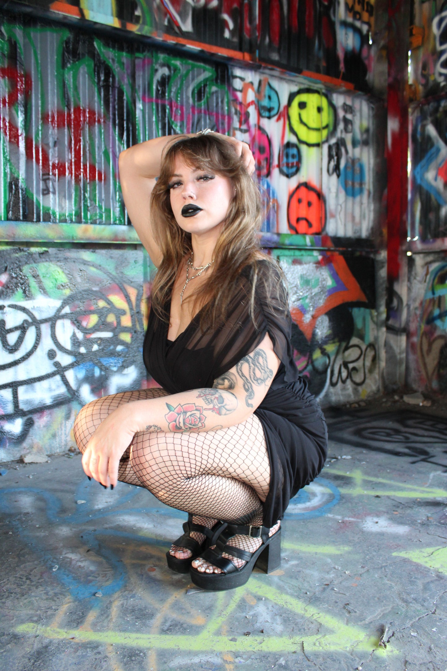 Fashion-forward look showcasing Necessary Evil Venus Wrapped Mesh Mini Dress paired with bold accessories, epitomising dark alternative style.