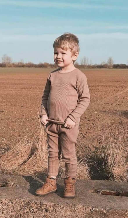 Chic detail of DreamBuy Christmas pyjamas set fabric, highlighting the soft and snuggly ribbed texture ideal for a luxurious sleeping experience.