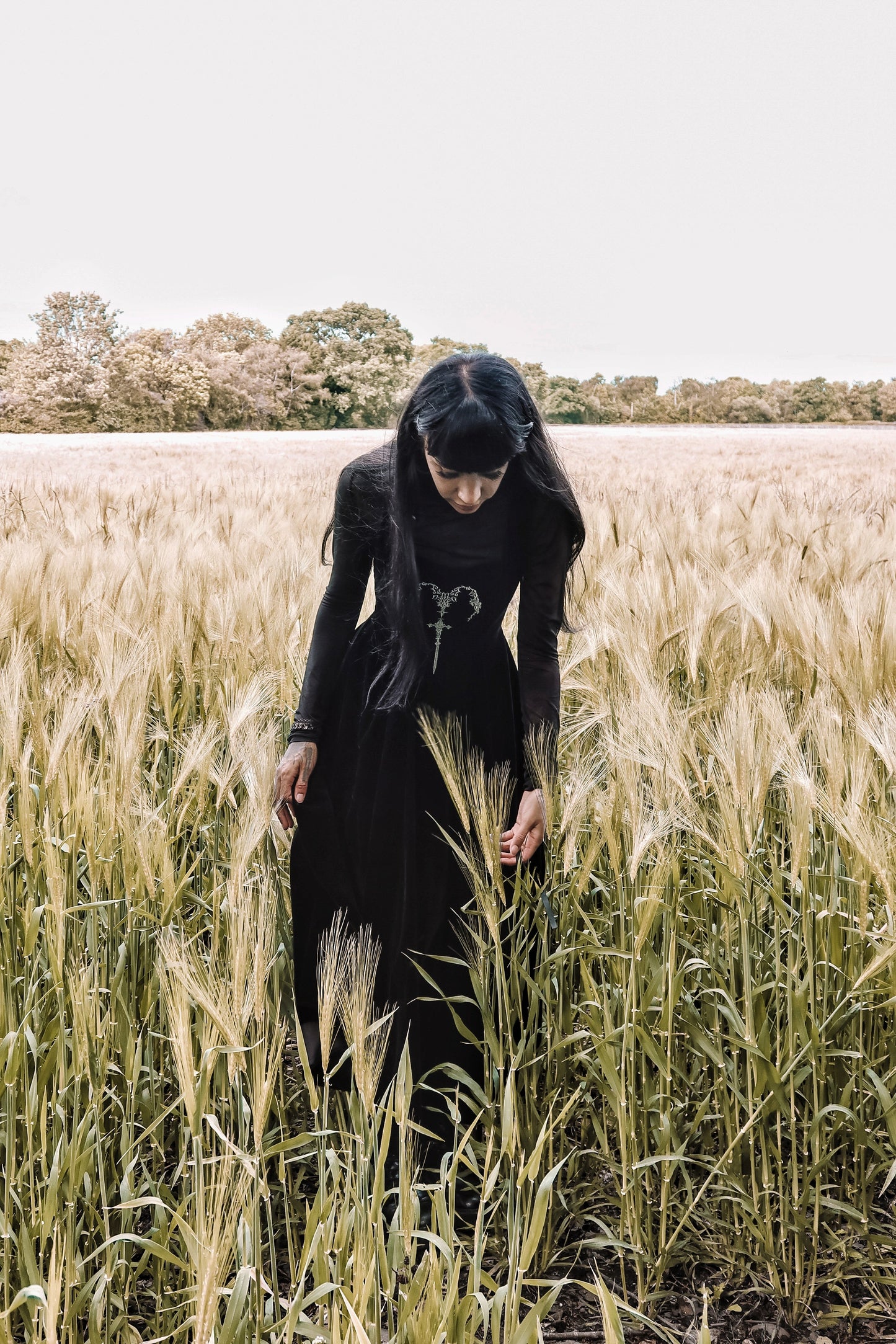 Back view of the Dark In Love Lux Black Velvet Maxi Dress highlighting the exquisite craftsmanship and flowing design, a perfect addition to any gothic wardrobe.
