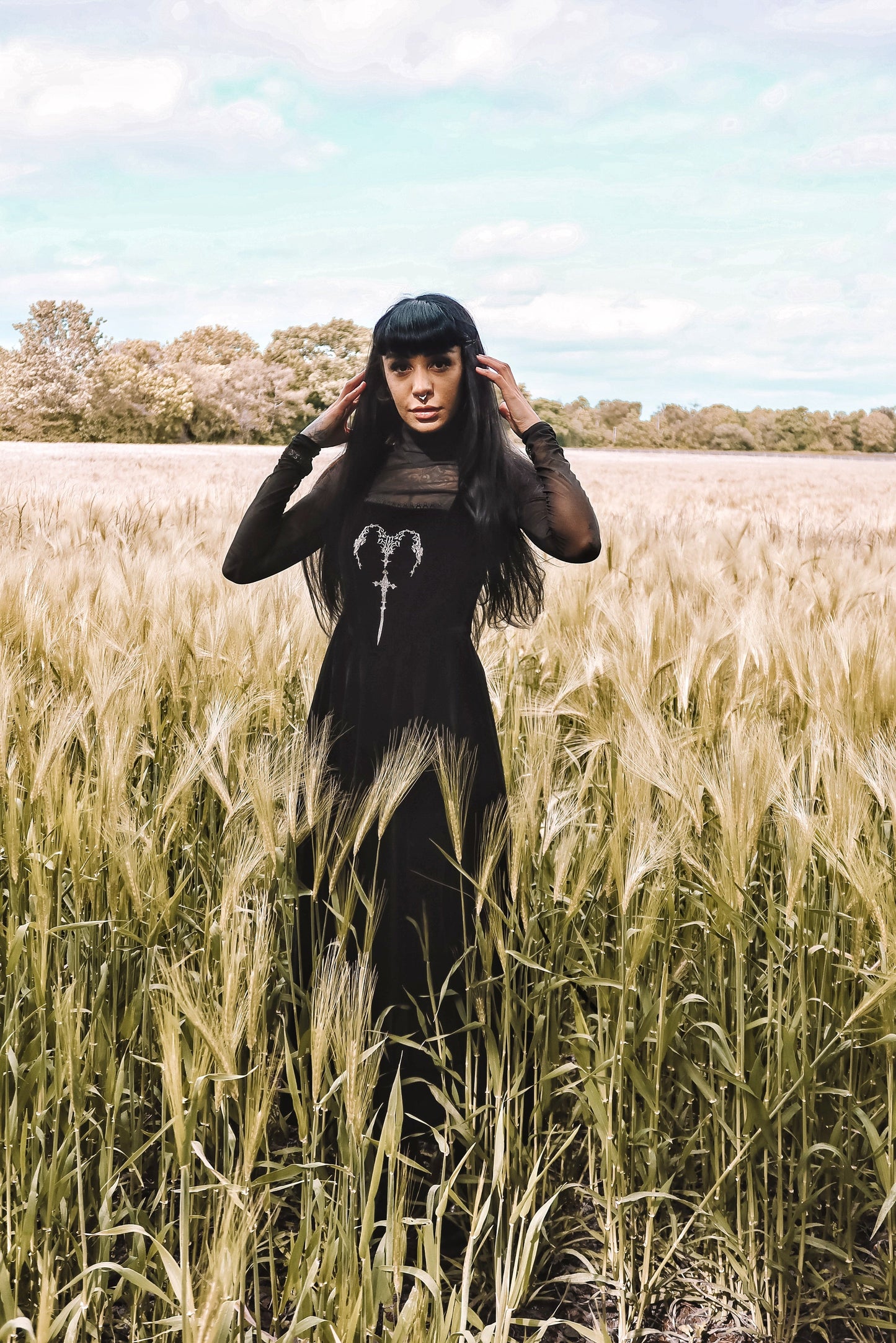 Luxurious black velvet maxi dress featuring gothic horn embroidery and a square neckline, expertly designed for elegance and style.