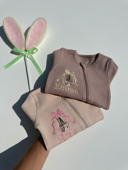 DreamBuy's cozy Bunny Zip Rompers for babies, showcasing elegant pastel tones and custom name embroidery, ideal for special Easter photoshoots and memorable moments.