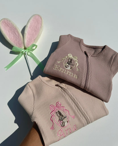 Stylish personalized Bunny Zip Sleepsuit by DreamBuy for babies aged 0-36 months, featuring exquisite embroidery and a delicate bow design, perfect for Easter celebrations.
