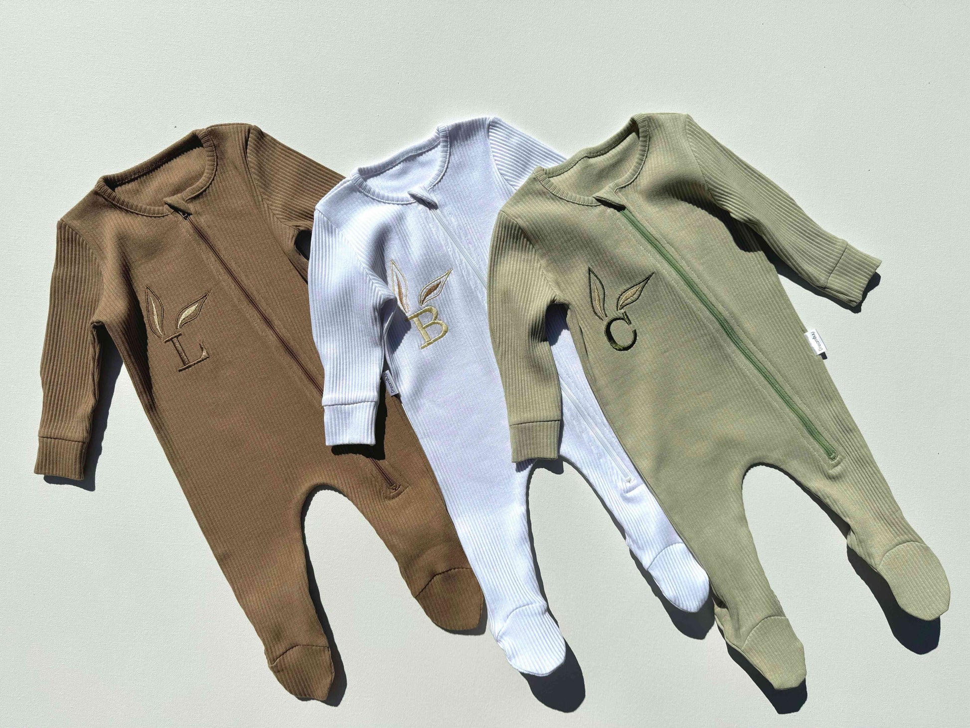 Stylish and practical, DreamBuy's personalised baby zip romper with a convenient zip fastening, perfect for quick diaper changes during Easter festivities.