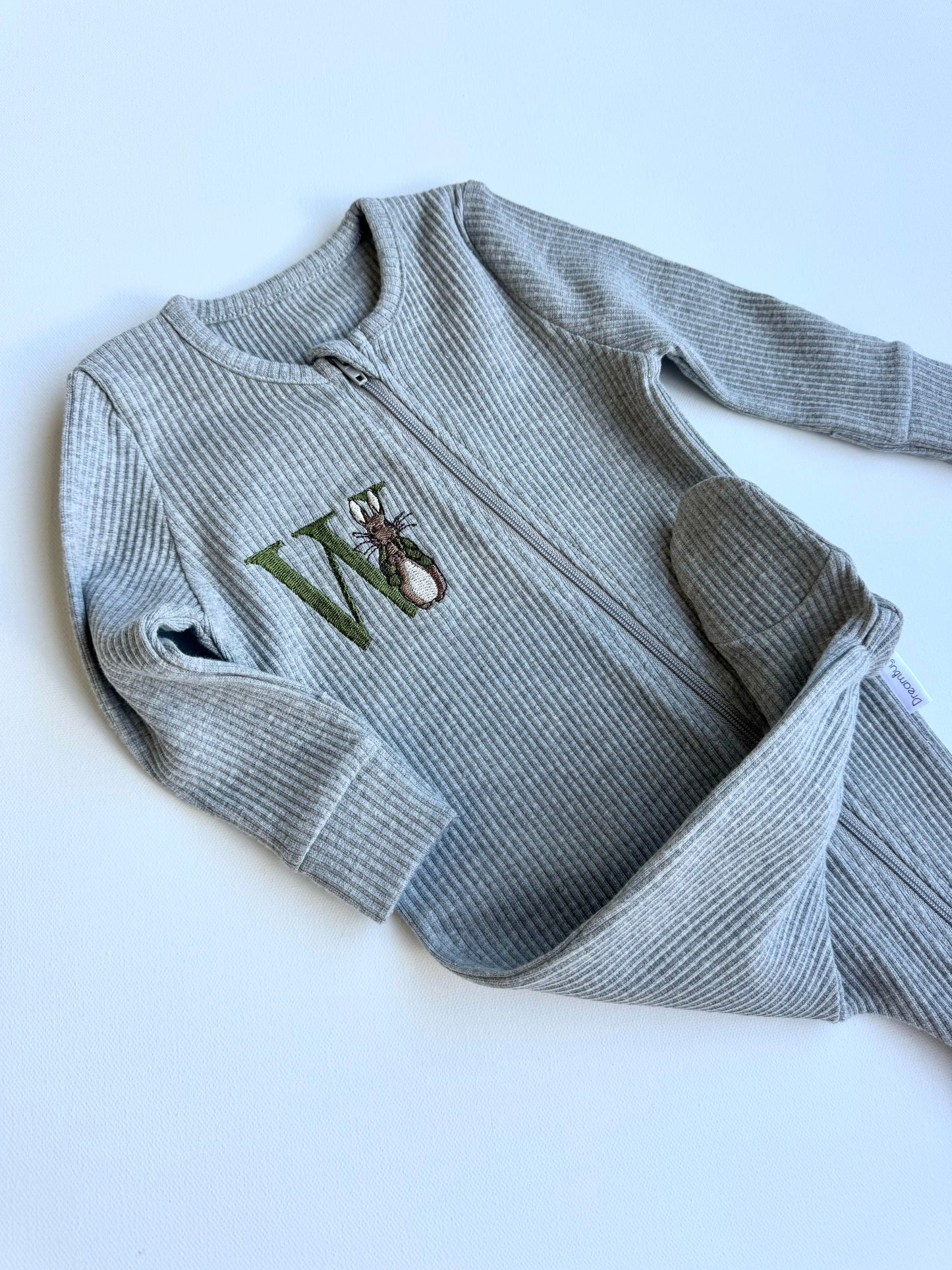 DreamBuy's versatile Woodland Bunny zip romper available for babies aged 0-36 months, perfect for gifting.