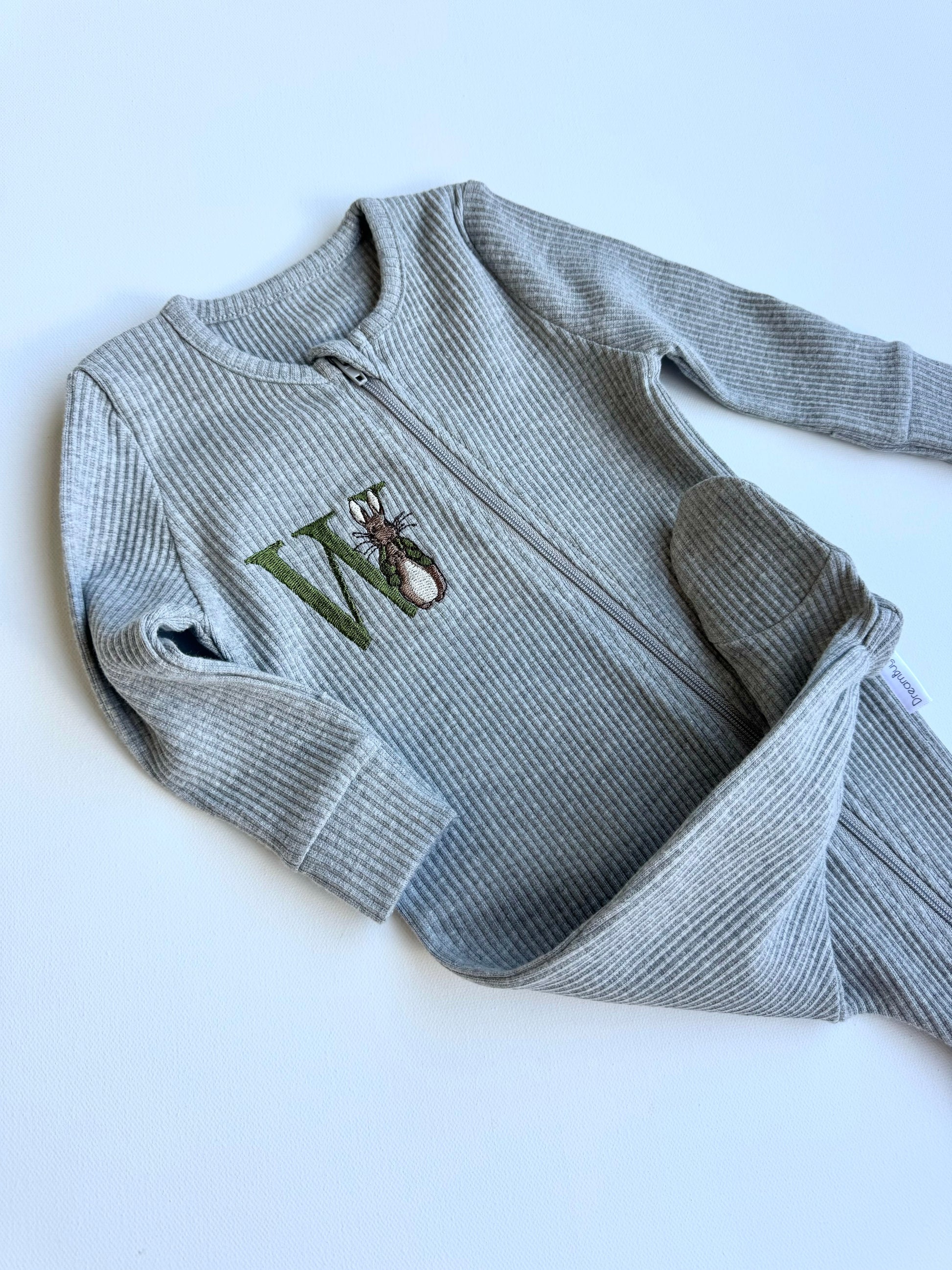 DreamBuy's versatile Woodland Bunny zip romper available for babies aged 0-36 months, perfect for gifting.