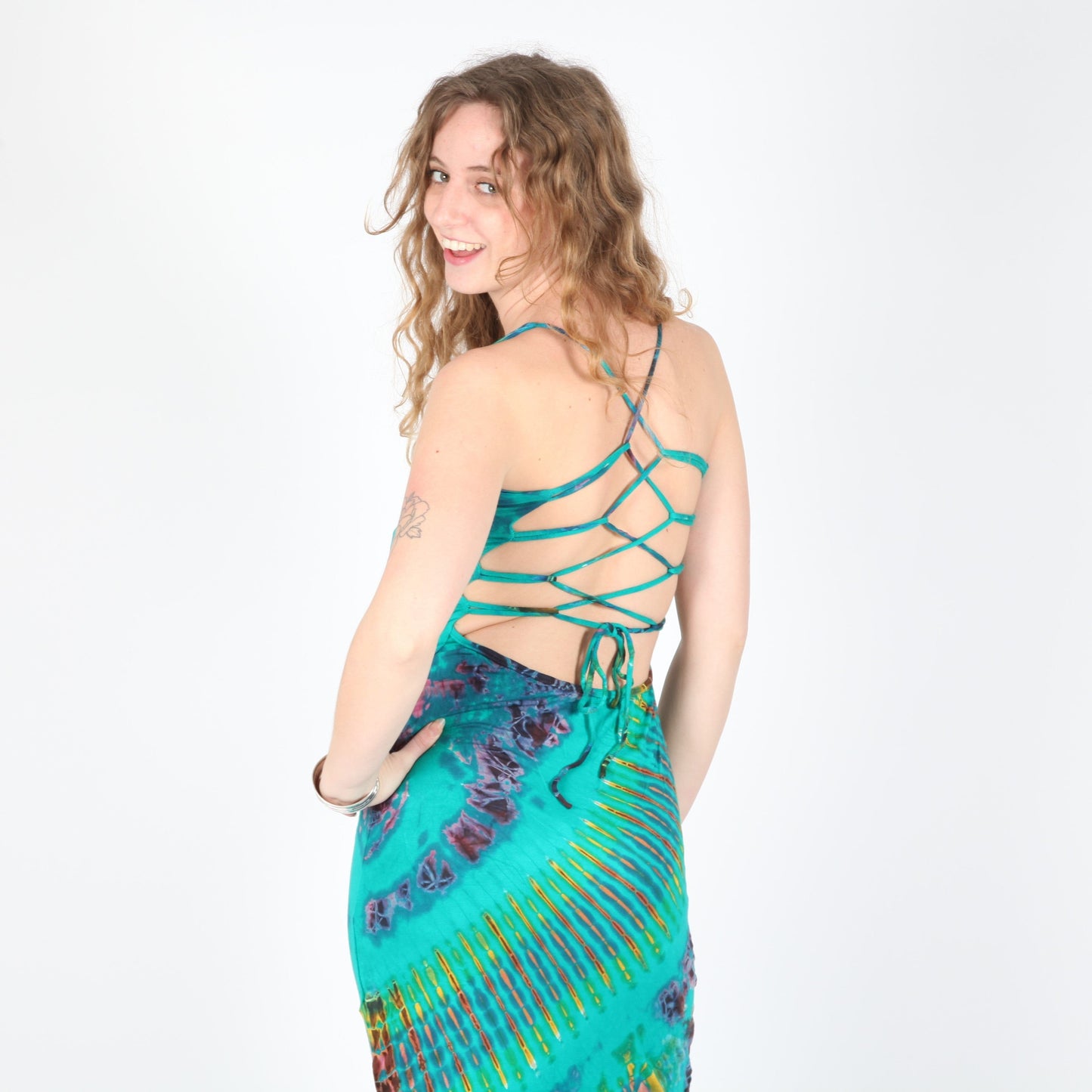 Vivid tie dye bodycon maxi dress showcasing strappy lattice back in luxurious vibrant colours, perfect for summer events.