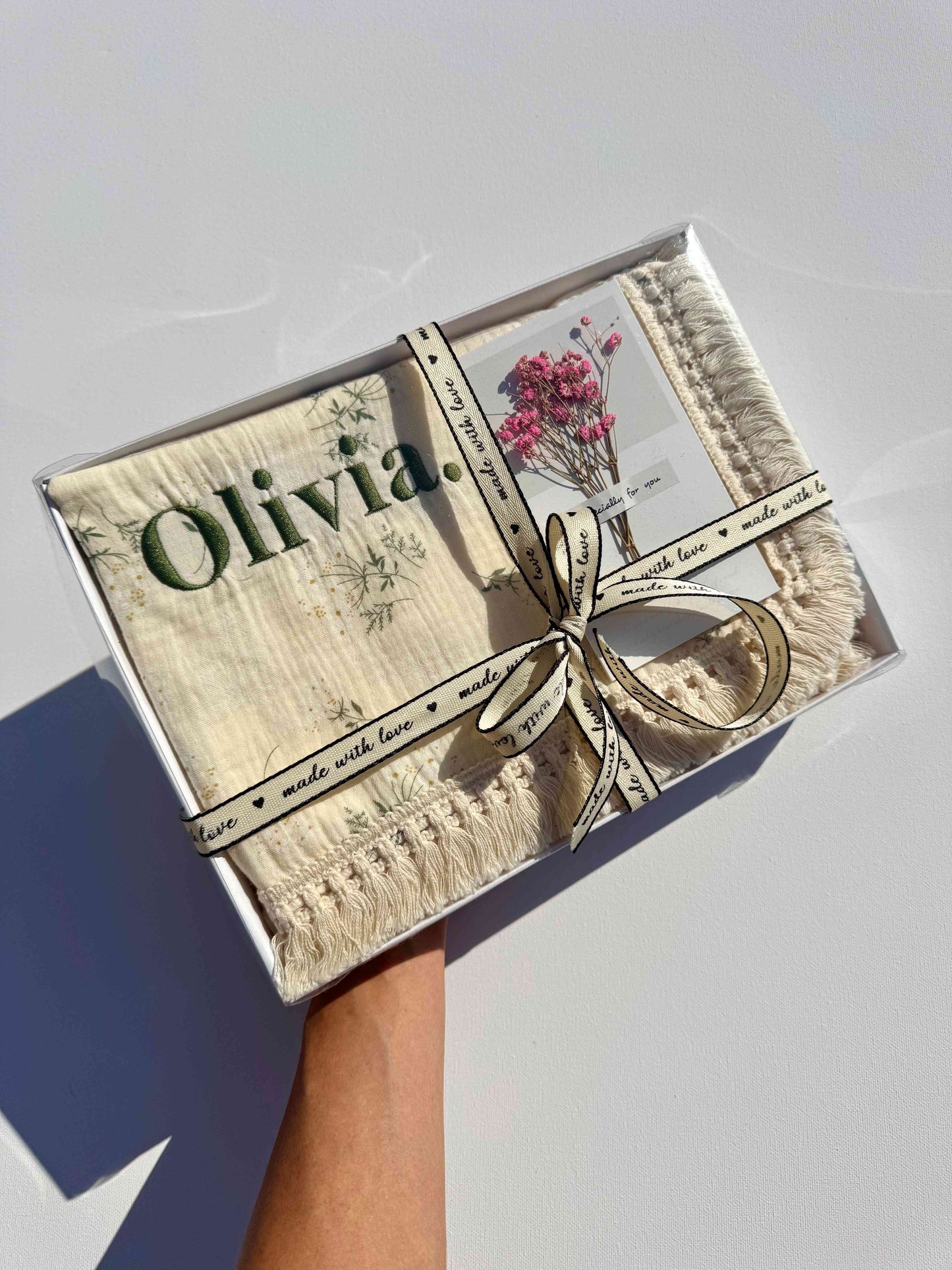 Luxurious taupe personalized muslin baby blanket by DreamBuy, made from 100% cotton, perfect for newborns, showcasing exquisite embroidery and soft texture.